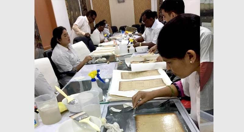 Police conservation team at work at the Mumbai Police Archives_Image credit_Gayatri Kamath (Tata Trusts Horizons Magazine).