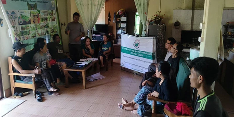 Community members in a participatory meeting for the excavation of trenches
